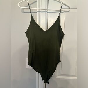 Pack of 3 Solid Colored Body Suits with snap bottom.